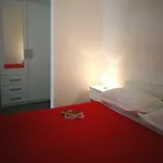 Em